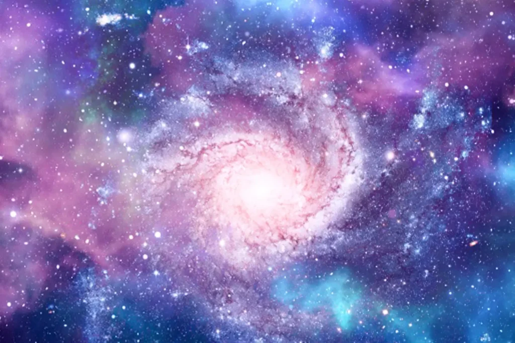 A colorful spiral galaxy swirls through deep space, with bright pink, purple, and blue hues blending among countless stars and nebulae.