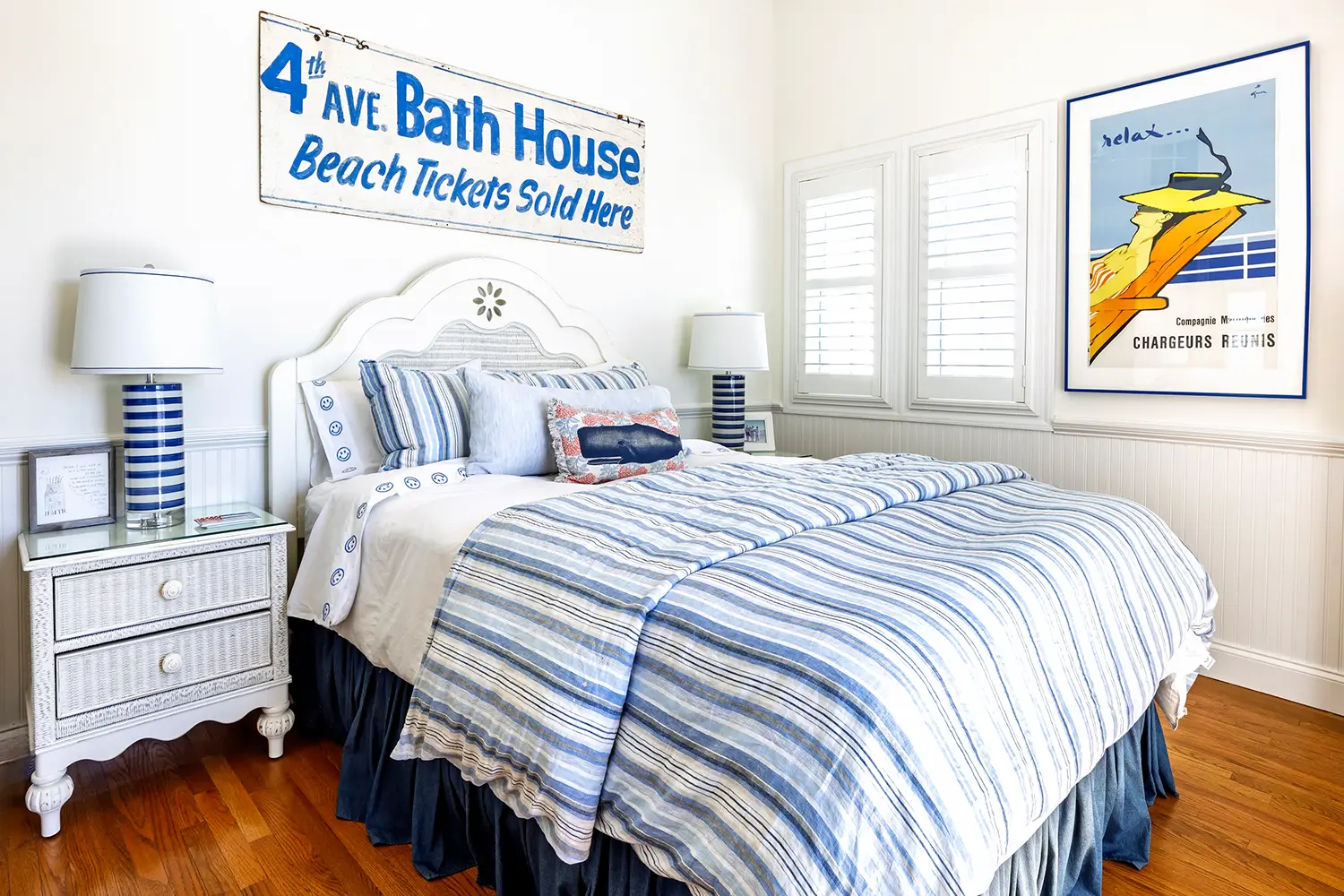 Bright coastal bedroom with blue-striped bedding and nautical decor from the 2025 LBIF Annual Seashore House Tour.