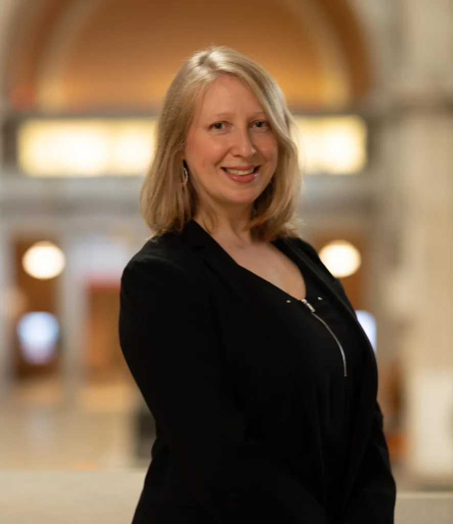 Portrait of Joanna Sheers Seidentstein in a black zipped blouse.